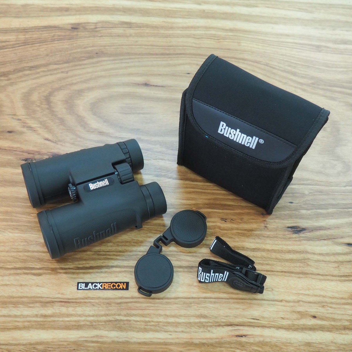 prismatico-bushnell-all-purpose-10x42-gris-accesorios